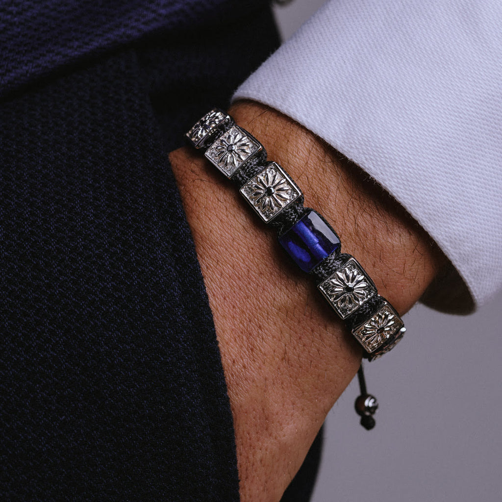 men with suit wearing silver 10mm flat square bead braided bracelet with blue sapphire - the guardian by mahigan jewelry