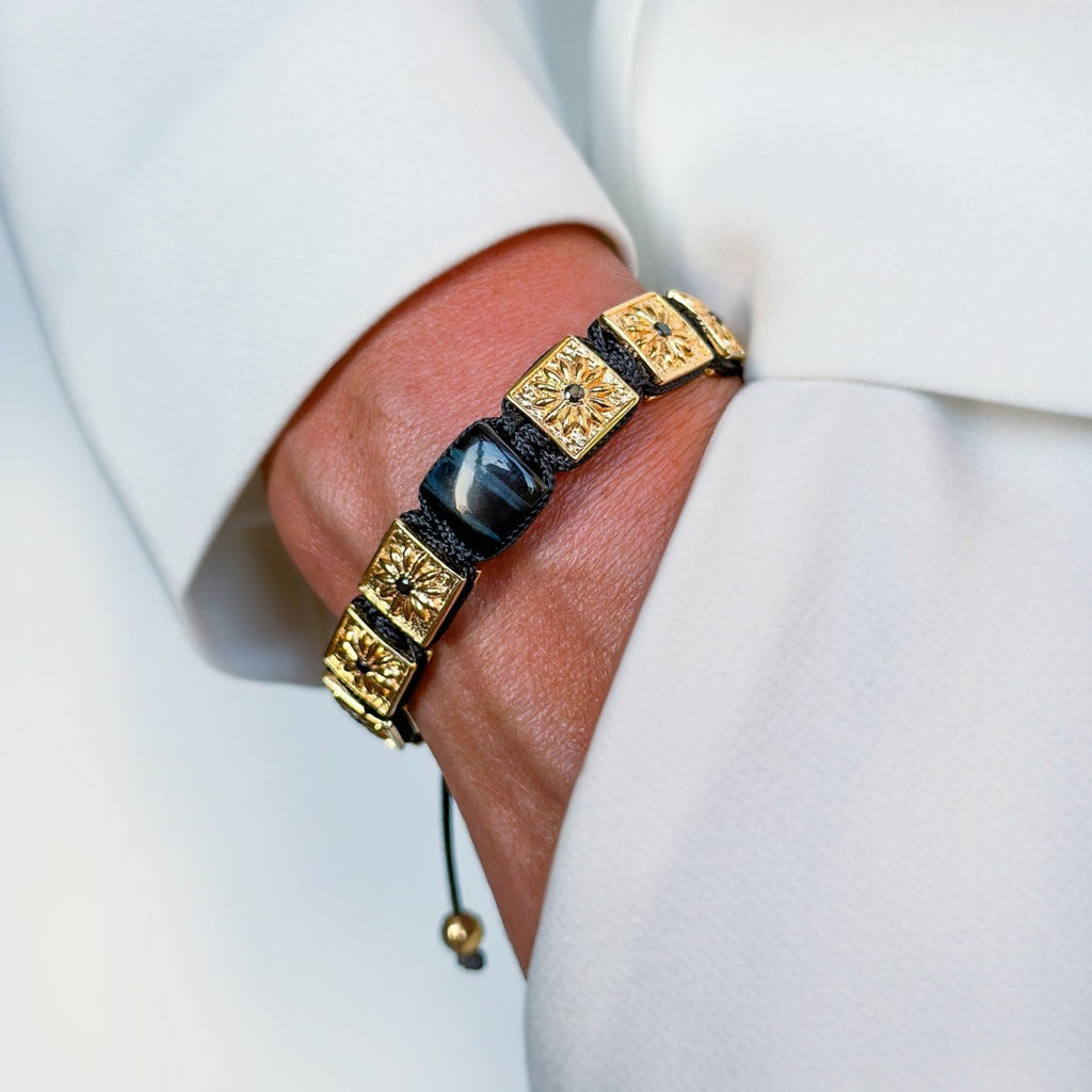 14k gold macrame bracelet with black stones and black string the guardian 