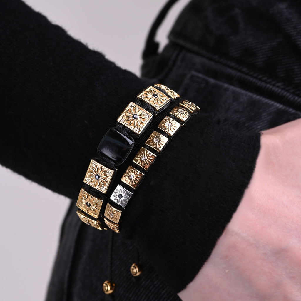 woman with black outfit wearing gold macrame bracelet stack by mahigan jewelry 