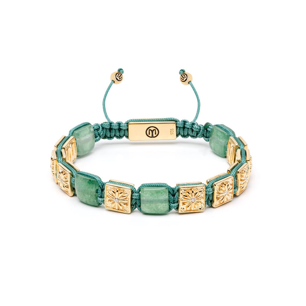 gold flatbead macrame bracelet with green strawberry quartz on a white background