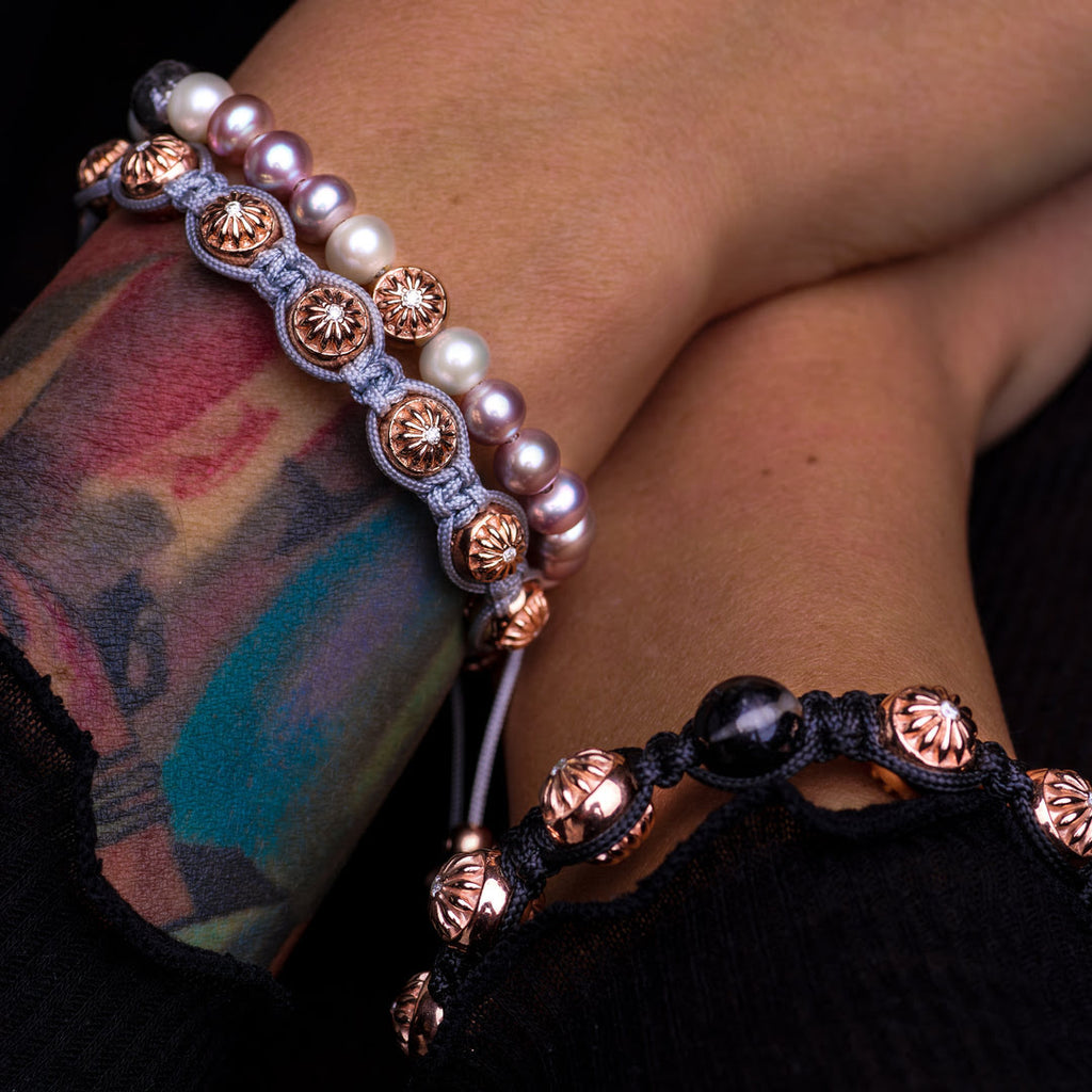 woman wearing rose gold  bracelet stack by mahigan jewelry