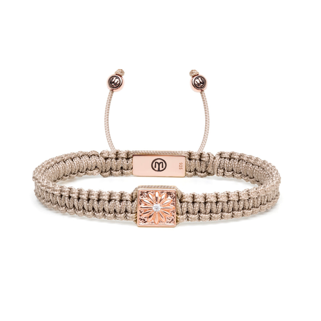 Rose Gold Macrame bracelet with white moissanite stone and beige string on a white background 