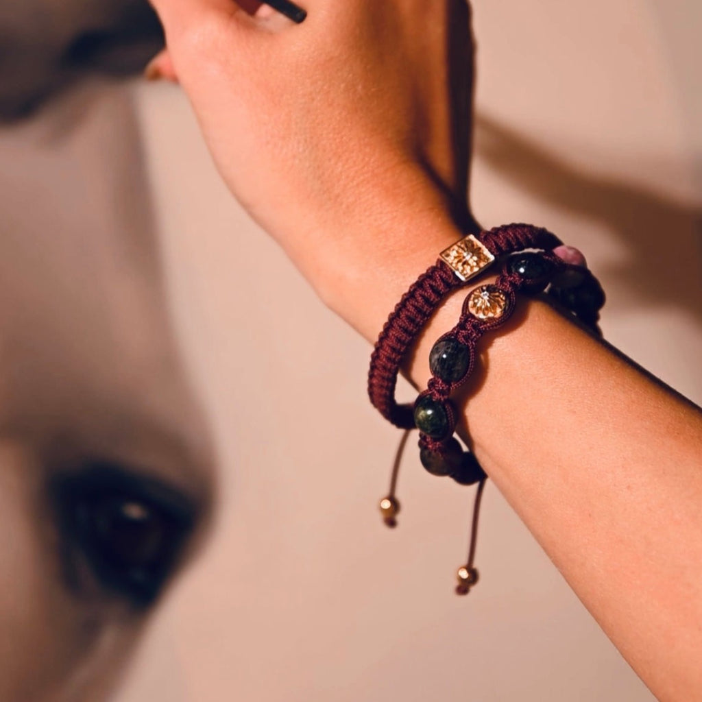 a painter wearing burgundy bracelet stack by mahigan 