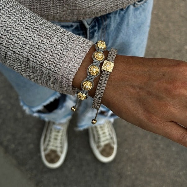 top view of a woman wearing gold bracelets mahigan