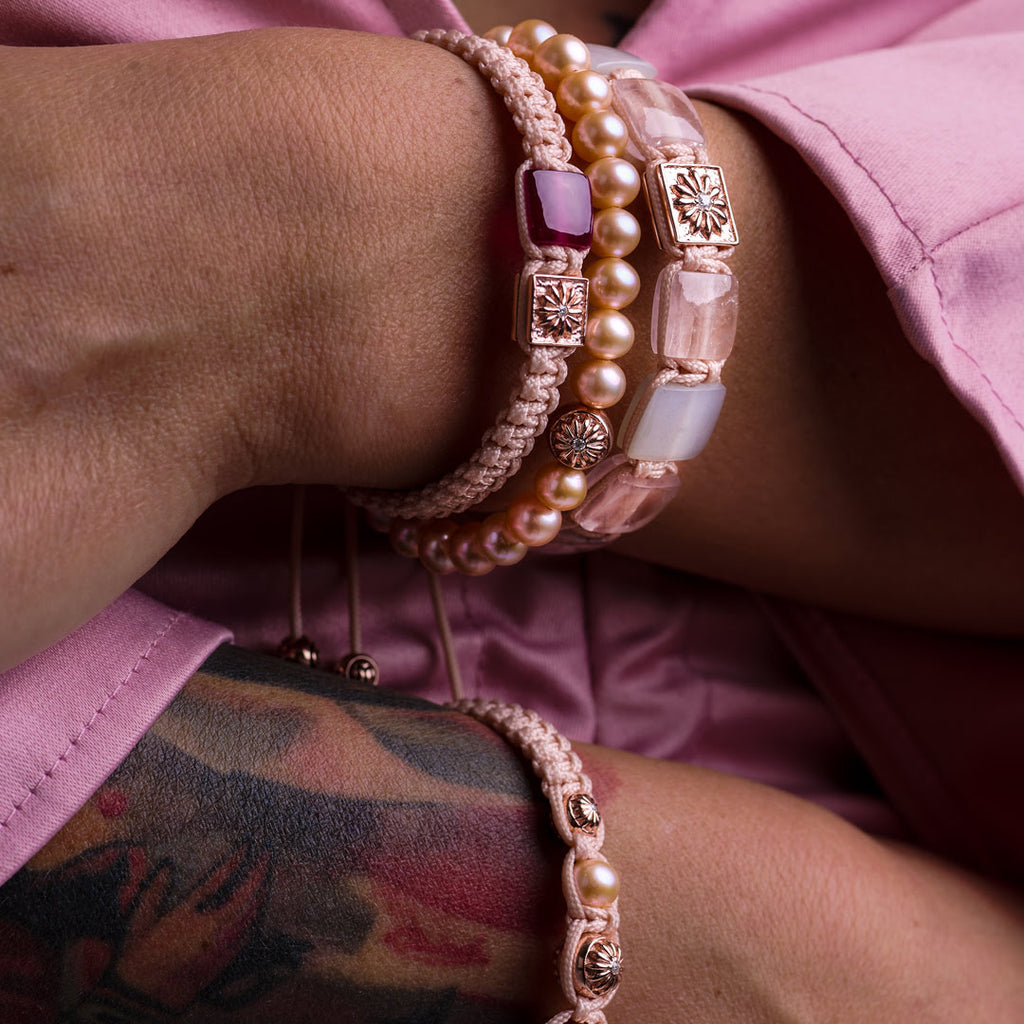 woman wearing pink bracelet stacks with rose gold "the sakura collection" by mahigan jewelry