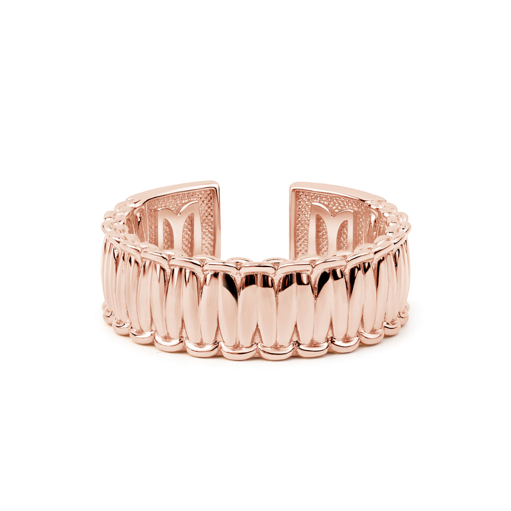 Rose gold ring with a textured band on a white background