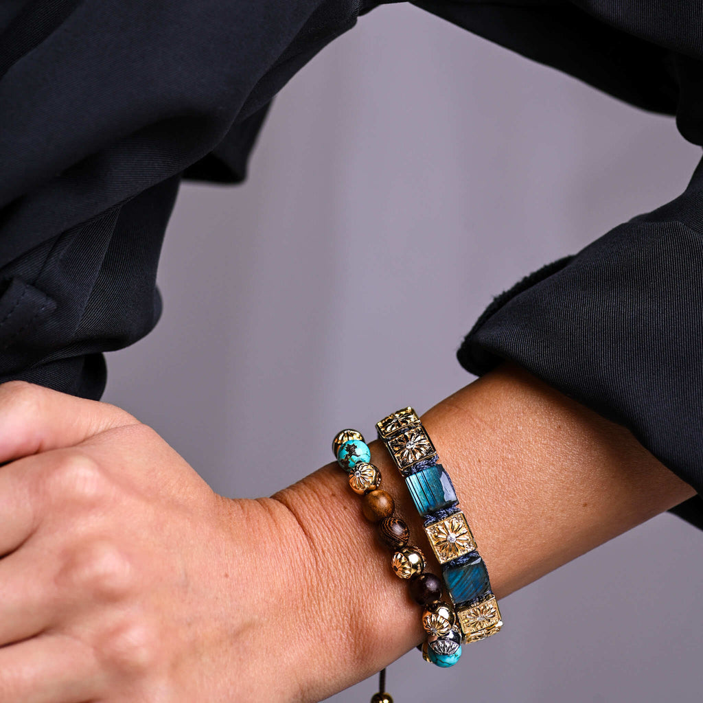 woman wearing bracelets with natural stones, sandalwood and gold by mahigan 
