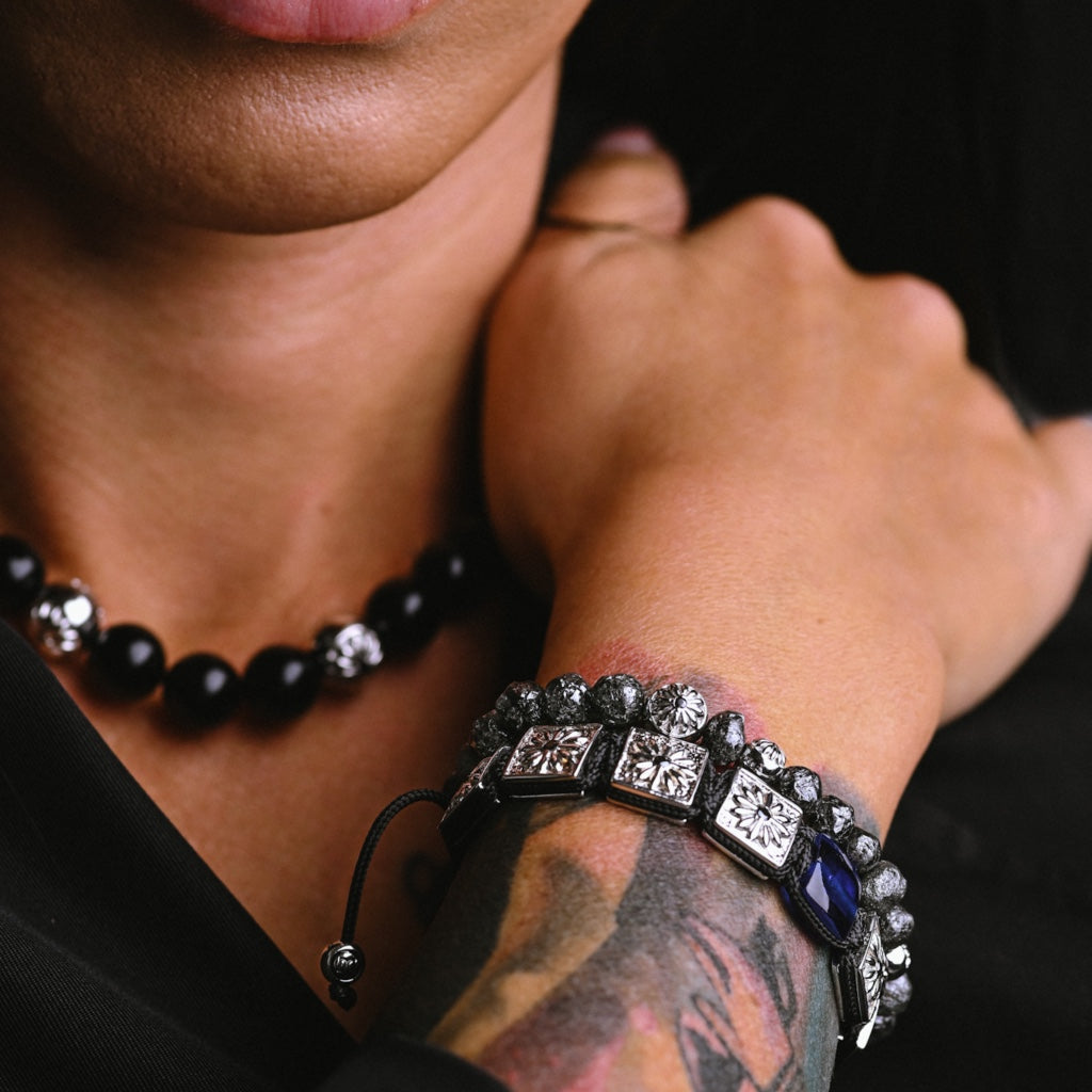 woman wearing silver macrame bracelet with blue sapphire and rough diamond bracelet " the oracle" by mahigan.